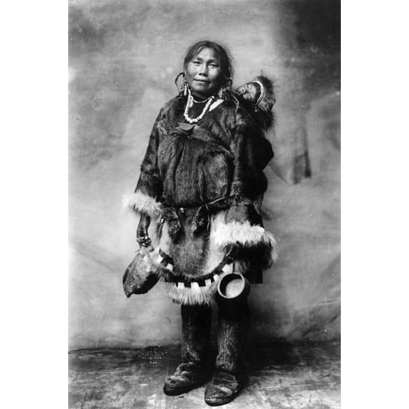 Print: Eskimo Mother Carrying A Child On Her Back, circa 1916