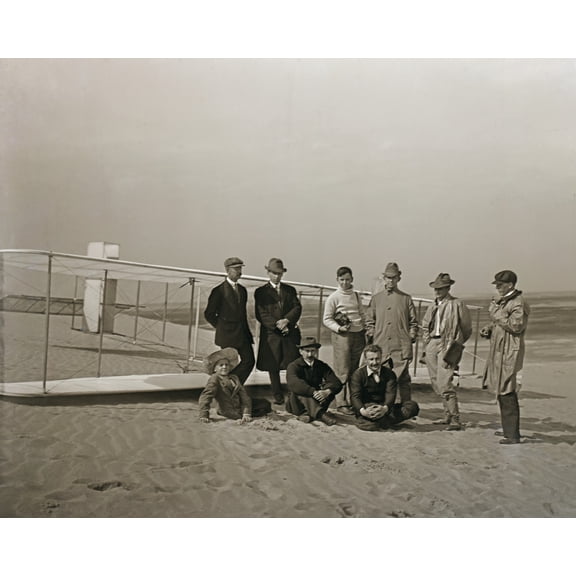 Print: Group Portrait In Front Of Glider At Kill Devil Hill. Sitting