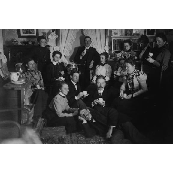Print: Group Portrait Of Friends At Social Gathering, Seated And Standing
