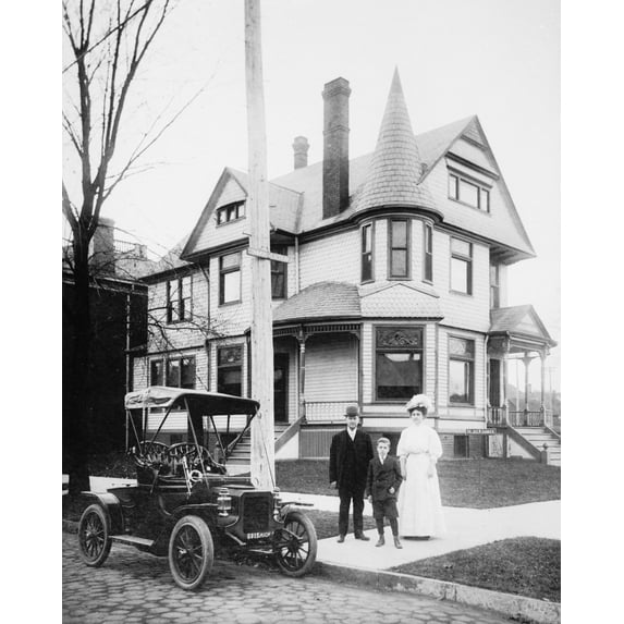 Print: Man, Woman, and Boy Standing in Front of House, circa 1900-1920