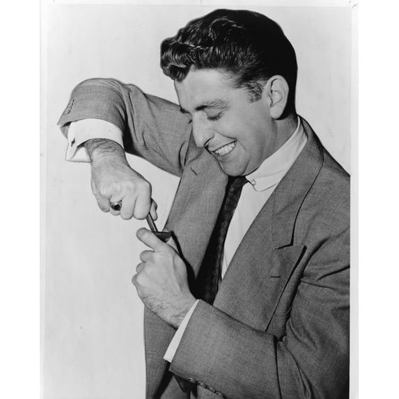 Print: Man Wrestles With Manual Razor In Television Commercial, 1951