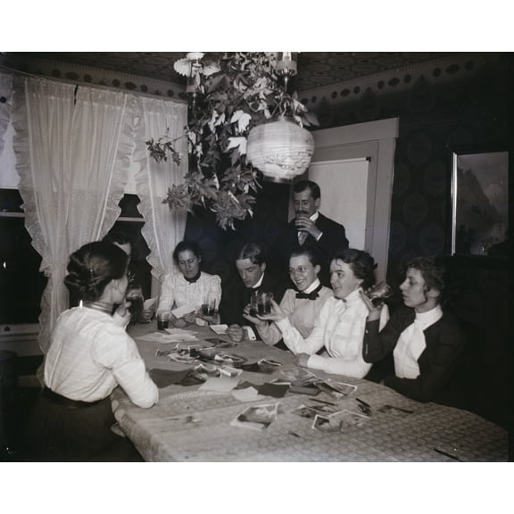 Print: Orville Wright And Group Around A Table, Looking At Photographs