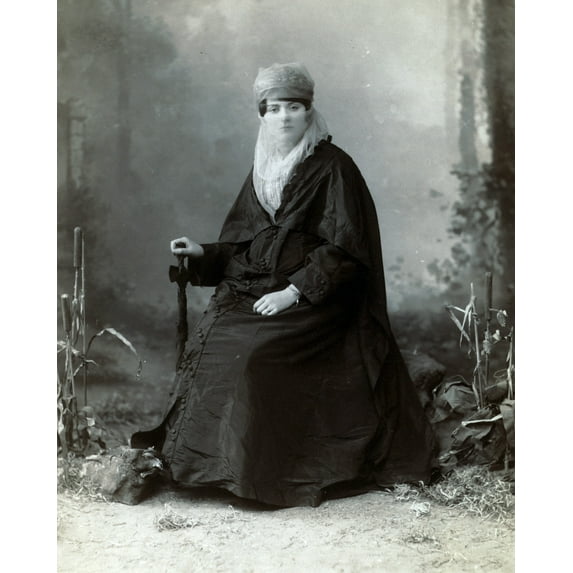 Print: Turkish Woman, Full-Length Portrait, Seated, Facing Front, Holding