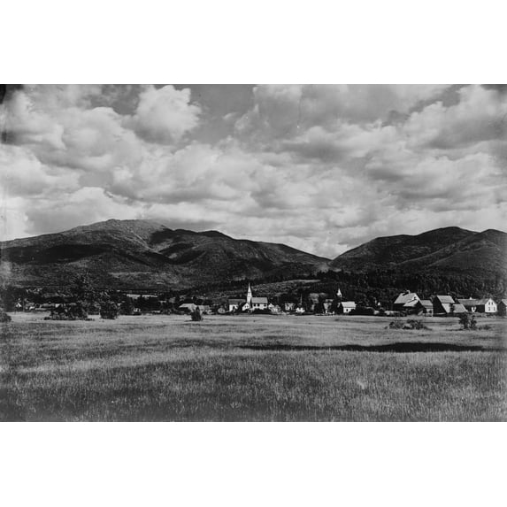 Print: View Across Meadow Of Town (Franconia?) With Hills In The