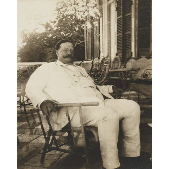 Print: William H. Taft, Seated In A Wicker Chair, Probably During His