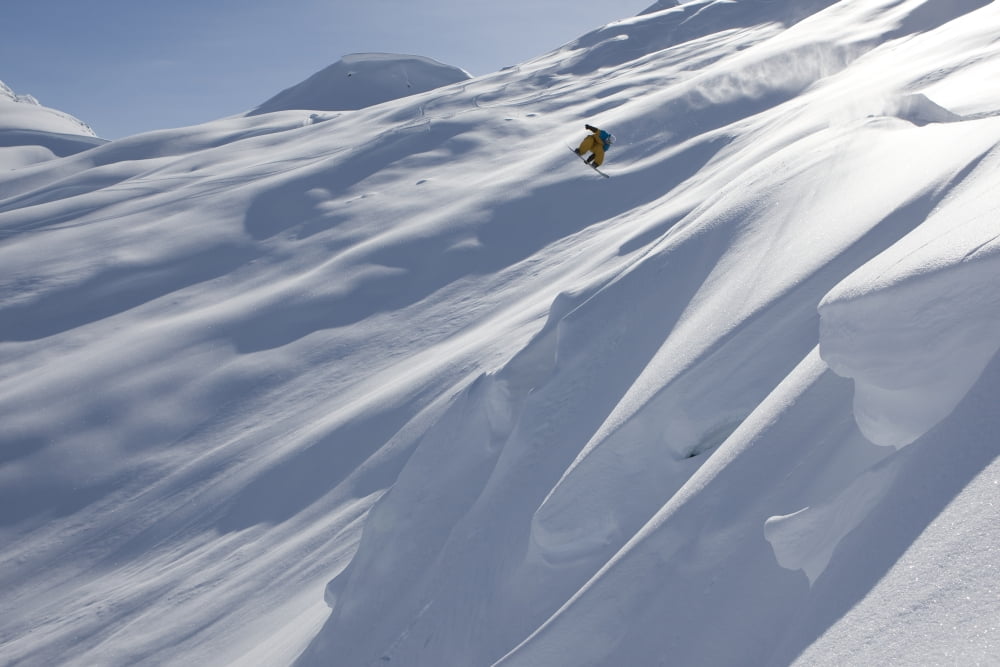 Professional snowboarder Frederik Kalbermatten heli boarding in the mountains above Haines Southeast Alaska Canvas Art - Dean Blotto Gray Design Pics (19 x 12)