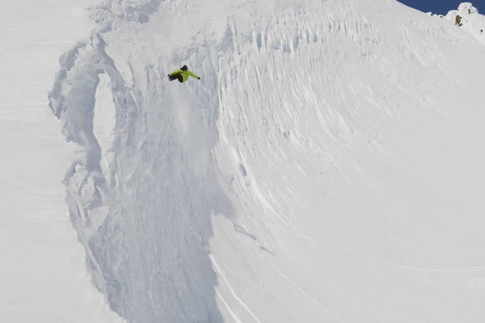 Professional snowboarder Kevin Pearce extreme heli boarding in the mountains above Haines Southeast Alaska Canvas Art - Dean Blotto Gray Design Pics (38 x 24)