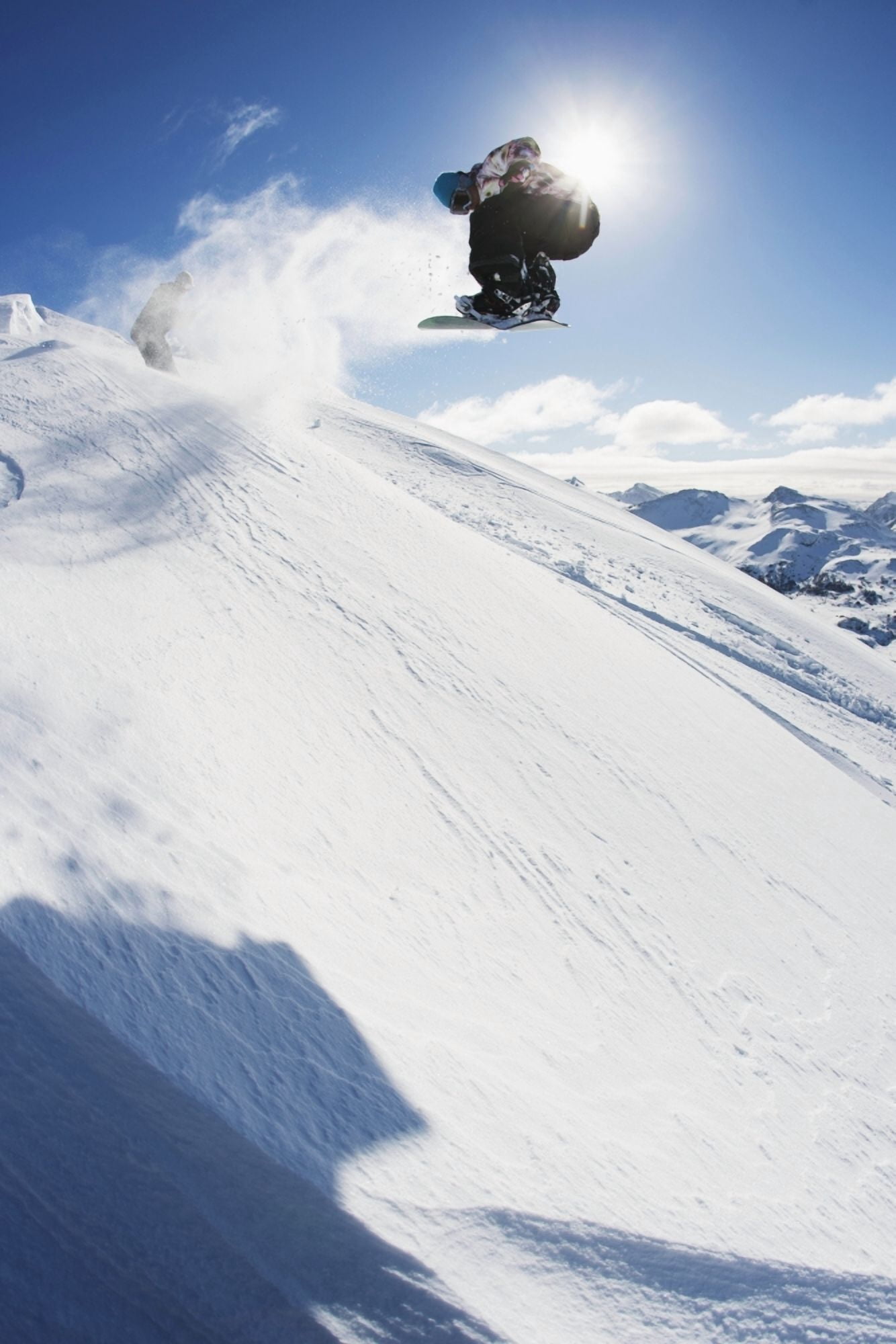 Professional snowboarder making a jump in fresh snow near Ushuaia Patagonia Argentina Canvas Art - Dean Blotto Gray Design Pics (12 x 19)