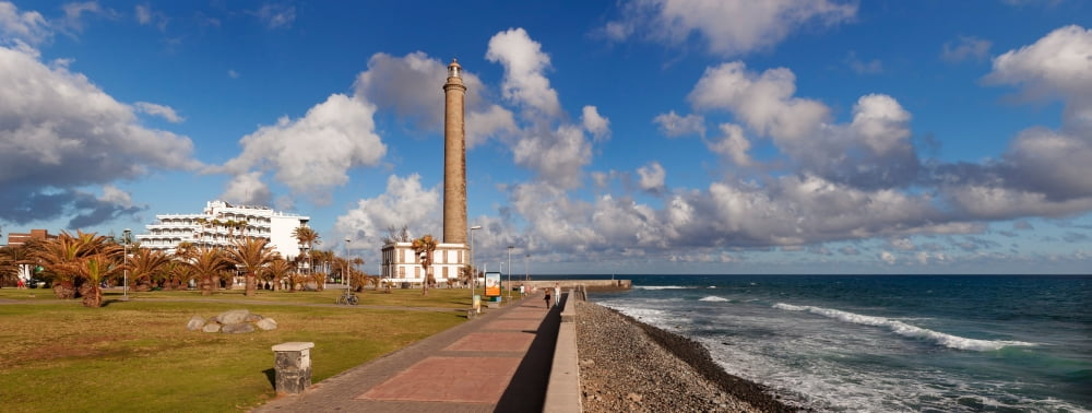 Promenade and lighthouse at coast Maspalomas Lighthouse Maspalomas Gran Canaria Las Palmas Canary Islands Spain Canvas Art - Panoramic Images (36 x 12)