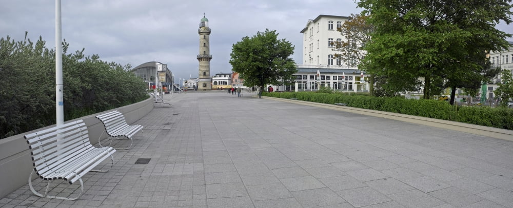 Promenade with lighthouse in the background Warnemunde Rostock Germany Canvas Art - Panoramic Images (27 x 9)