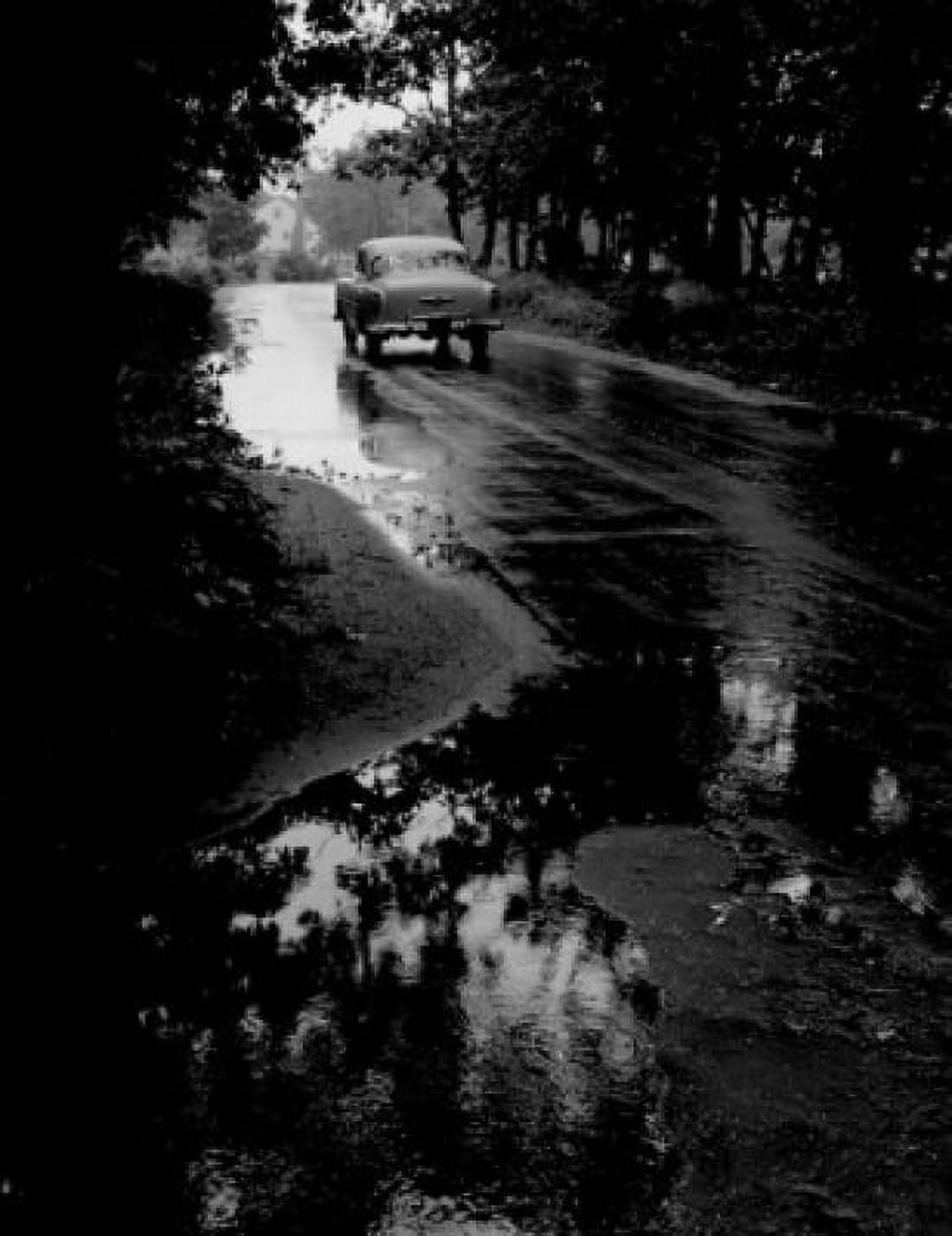 Puddle on road Canvas Art - (18 x 24)