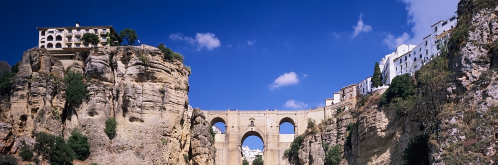 Puente Nuevo bridge above the gorge of the Guadalevin River Ronda Malaga Province Andalusia Spain Canvas Art - Panoramic Images (27 x 9)