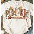 thumbnail image 1 of Pumpkin Season T-shirt, Retro Halloween Shirt, Preppy Pumpkin Bow Shirt, Halloween Shirt, Trendy Fall Pumpkins, Spooky Season TH230620, 1 of 5