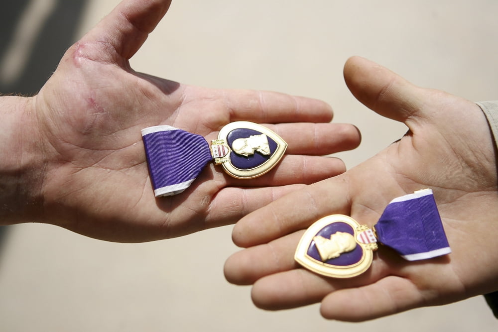 Purple Heart recipients display their medals in their hands Canvas Art - Stocktrek Images (34 x 23)