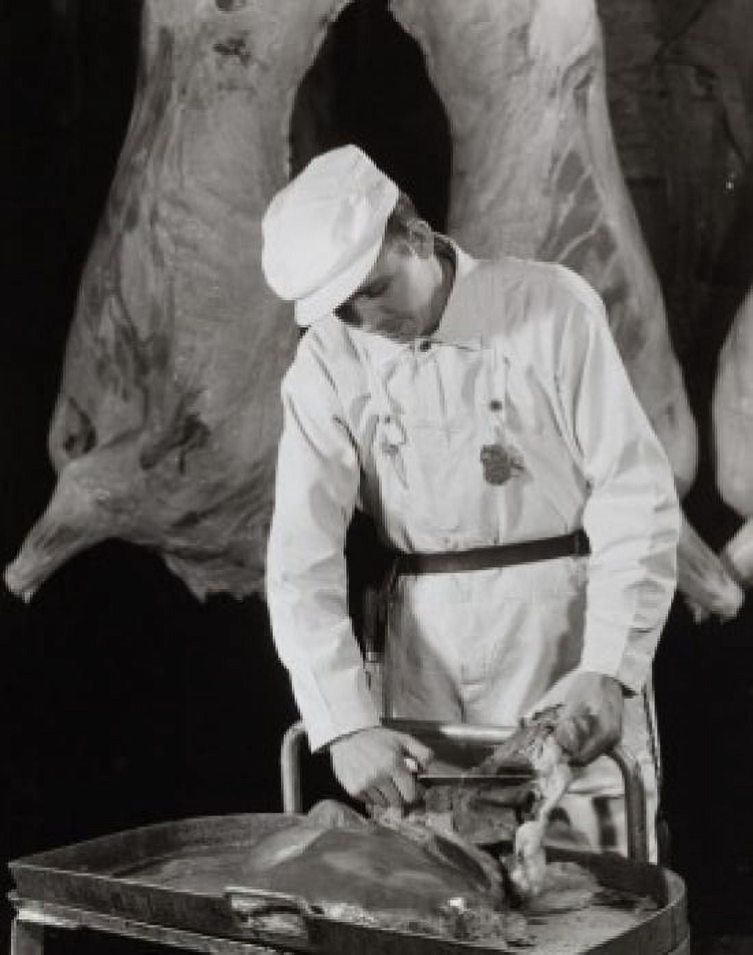 Quality inspector inspecting meat of a food processing iplant Swift and Company Canvas Art - (18 x 24)