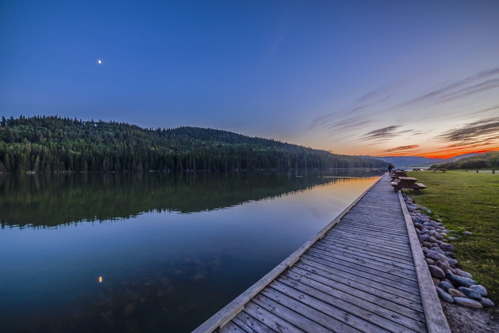Quarter moon reflected in the waters of Reesor Lake Alberta Canada Canvas Art - Alan DyerStocktrek Images (34 x 23)