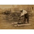 thumbnail image 1 of Railroad construction worker straightening track; pile of twisted rails in background. 1862-63 Poster Print, 1 of 4