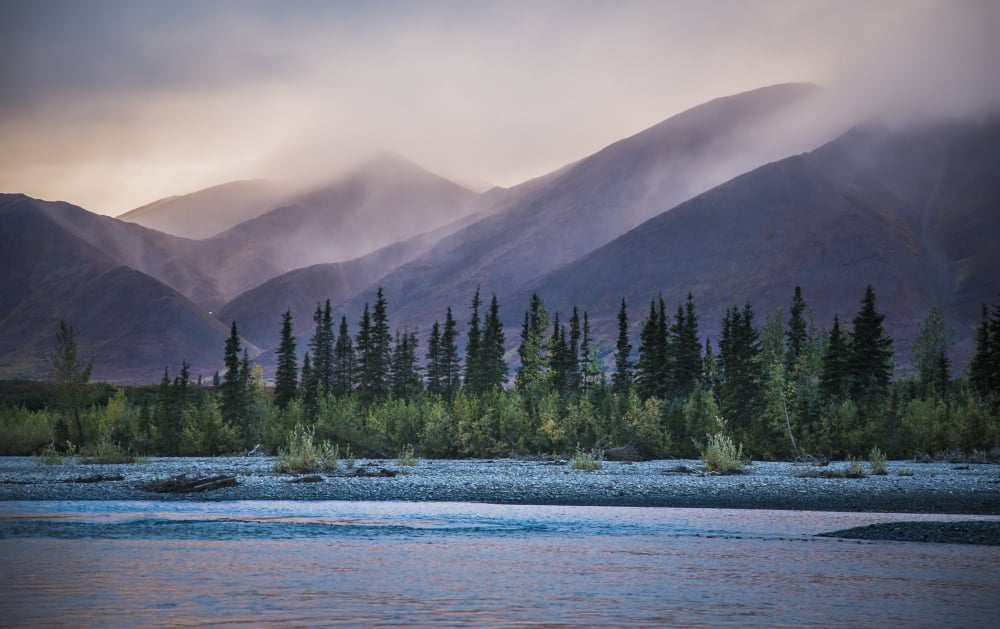 Rain and snow squalls race over the mountains during sunset on the Kelly River in the western Brooks Range of Noatak National Preserve Alaska USA Canvas Art - David Shaw Design Pics (19 x 12)