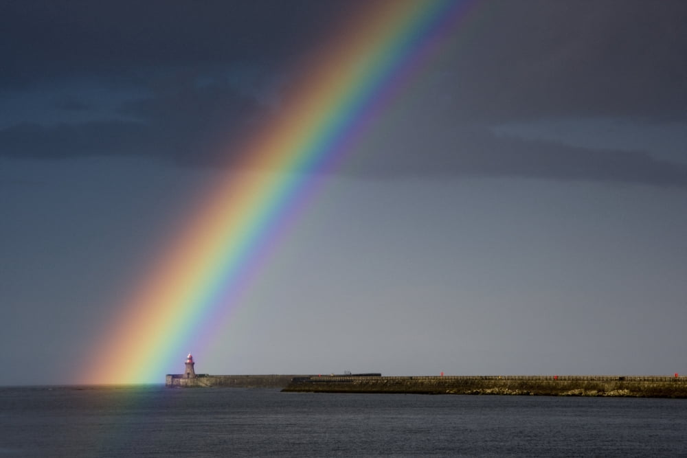 Rainbow Over Lighthouse Canvas Art - John Short Design Pics (17 x 11)