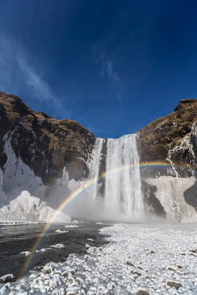 Rainbow over Skogarfoss Waterfall in the Winter Iceland Canvas Art - Panoramic Images (36 x 12)
