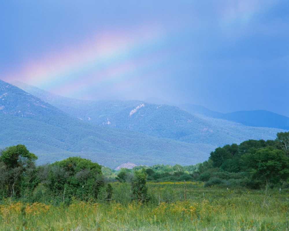 Rainbow over a mountain range Taos Taos County New Mexico USA Canvas Art - Panoramic Images (22 x 27)