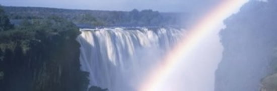 Rainbow over a waterfall Victoria Falls Zambezi River Zimbabwe Canvas Art - Panoramic Images (36 x 12)