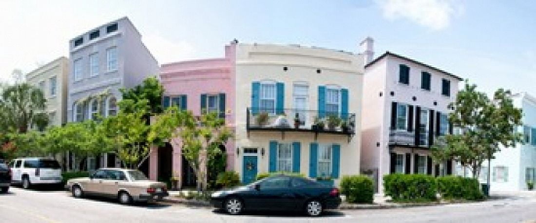 Rainbow row colorful houses along a street East Bay Street Charleston South Carolina USA Canvas Art - Panoramic Images (30 x 13)