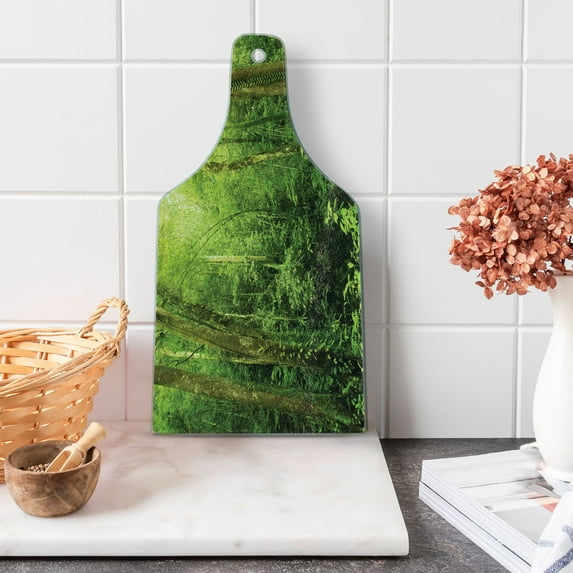 Rainforest Cutting Board, Tropical Rainforest Landscape Malaysia Asia Green Tree Trunks Uncultivated Wood Print, Tempered Glass Cutting and Serving Board, Wine Bottle Shape, Green, by Ambesonne