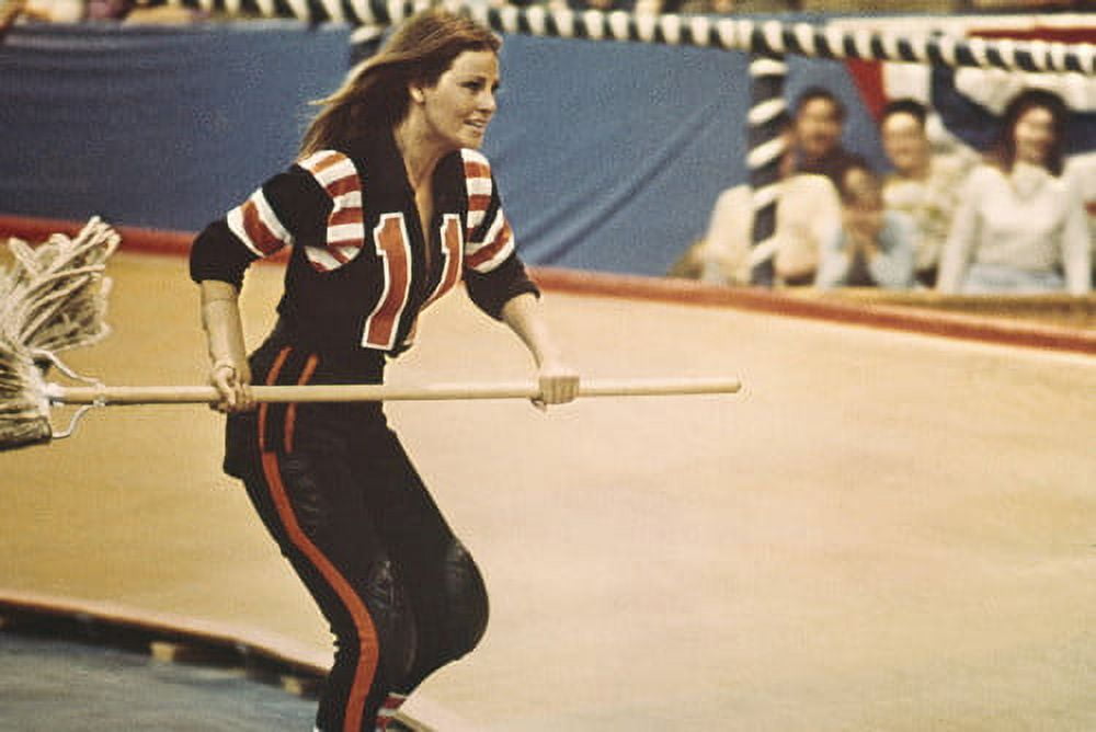Raquel Welch in Kansas City Bomber holding mop skating in roller derby