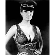 Raquel Welch shows off her ample cleavage in dominatrix corset & cap 8x10 photo