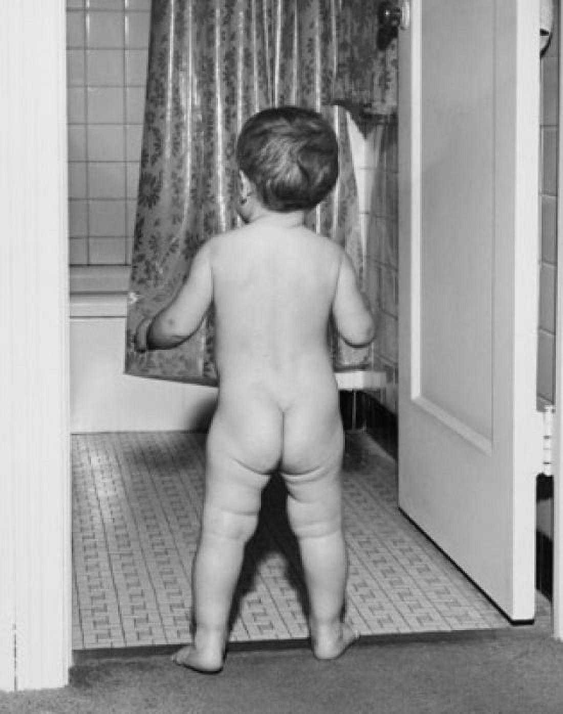 Rear view of a baby standing at the door of bathroom Canvas Art - (24 x 36)