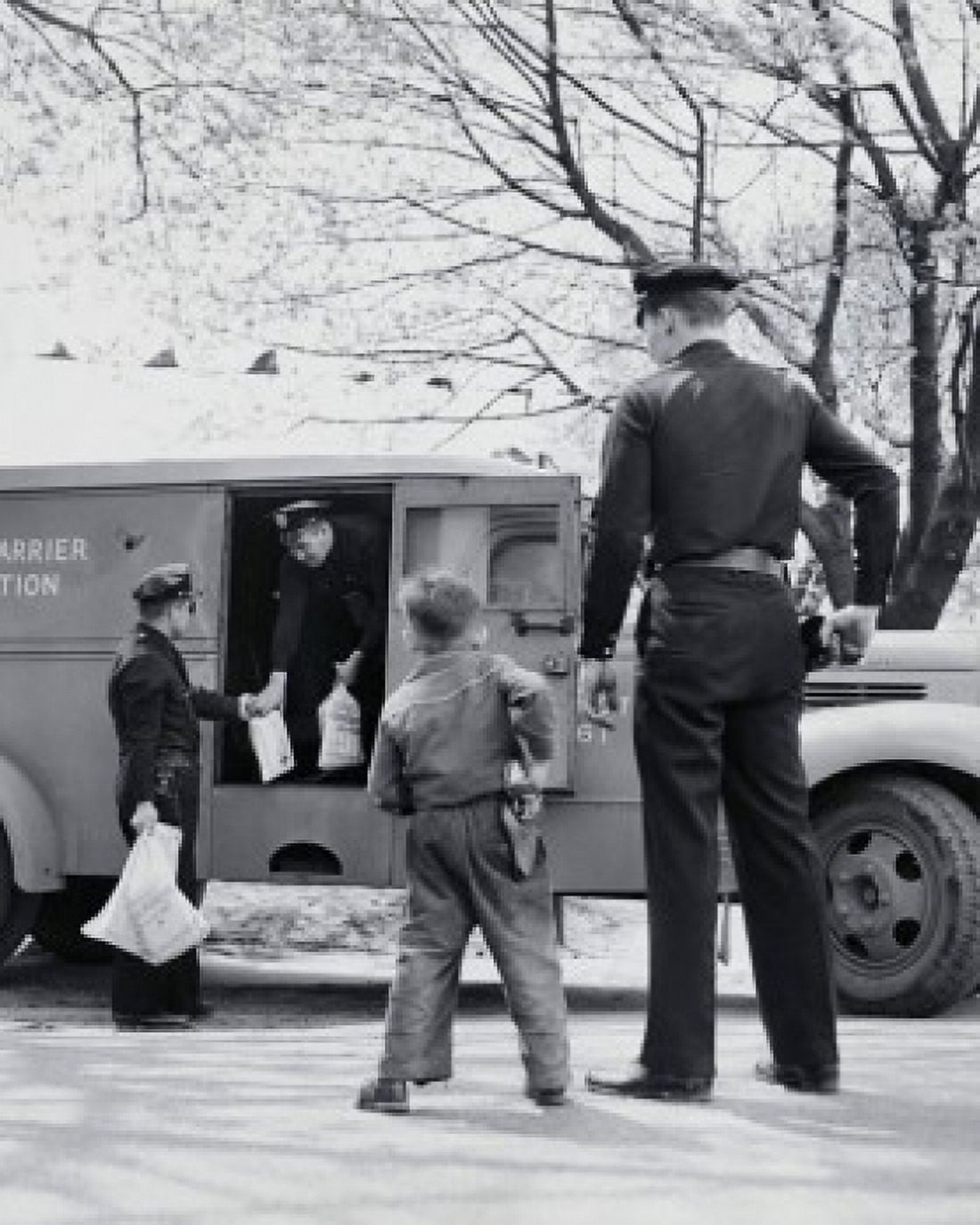 Rear view of a boy imitating a security guard and standing near an armored truck Canvas Art - (18 x 24)