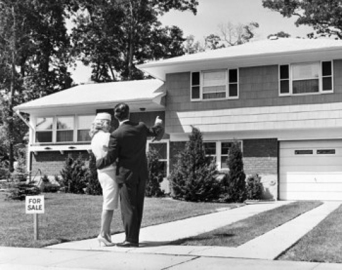Rear view of a couple standing in front of a house Canvas Art - (18 x 24)