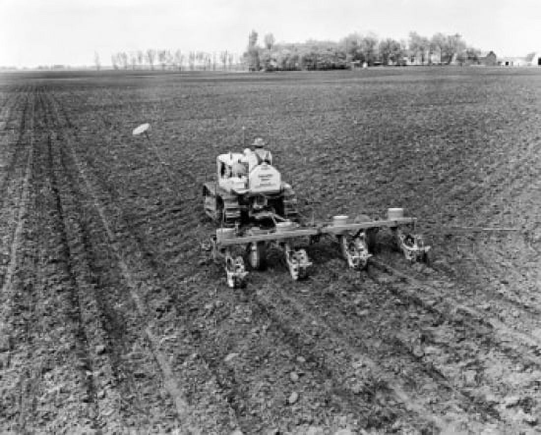 Rear view of a farmer plowing a corn field with a tractor Hutchinson Minnesota USA Canvas Art - (18 x 24)