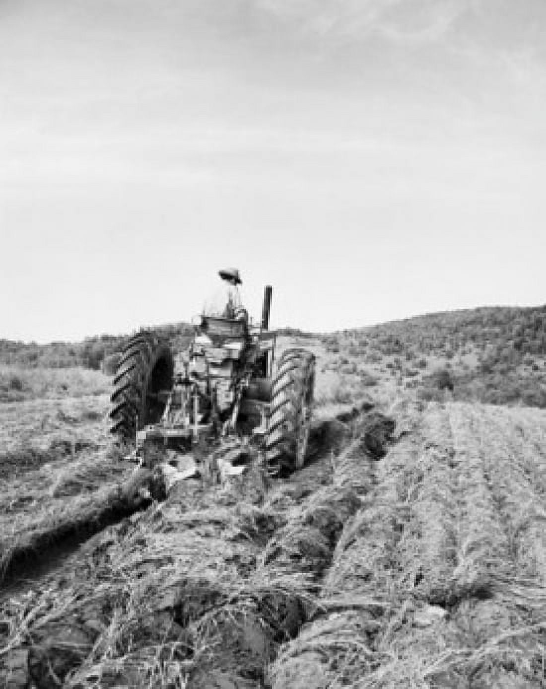 Rear view of a farmer plowing a field with a tractor Canvas Art - (24 x 36)