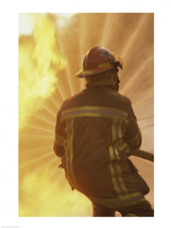 Rear view of a firefighter extinguishing a fire Canvas Art - (18 x 24)