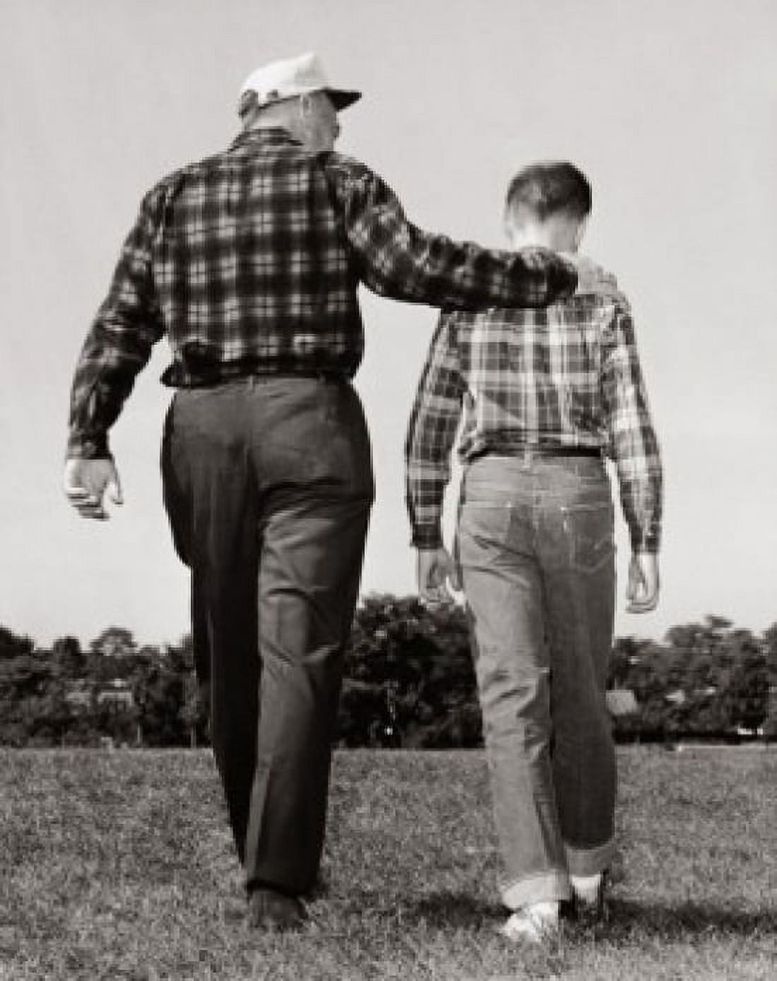 Rear view of a grandfather and his grandson walking in a park Canvas Art - (18 x 24)