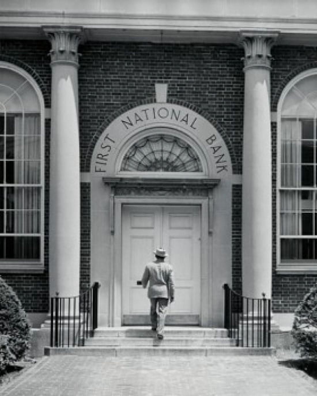 Rear view of a man entering a bank Canvas Art - (18 x 24)