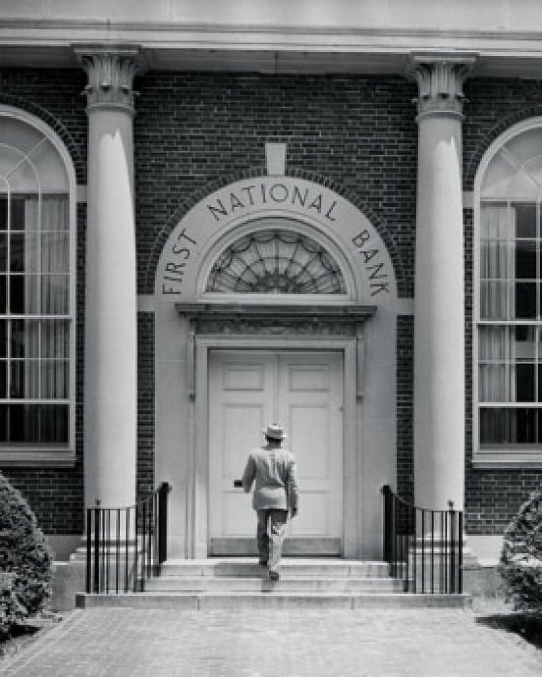 Rear view of a man entering a bank Canvas Art - (24 x 36)