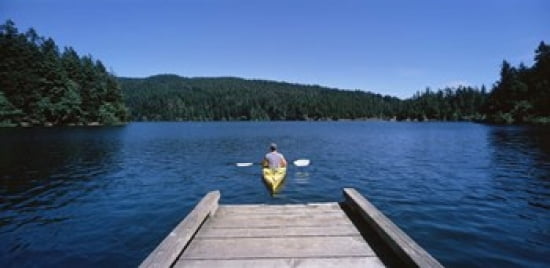 Rear view of a man on a kayak in a river Orcas Island Washington State USA Canvas Art - Panoramic Images (24 x 12)