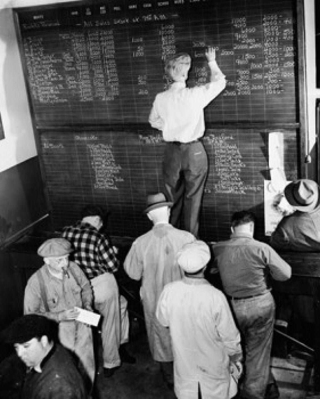 Rear view of a man writing price on a blackboard in an auction room New England Fish Exchange Boston Massachusetts USA Canvas Art - (18 x 24)