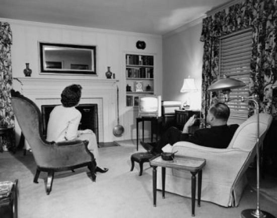 Rear view of a mature adult couple watching television Canvas Art - (18 x 24)