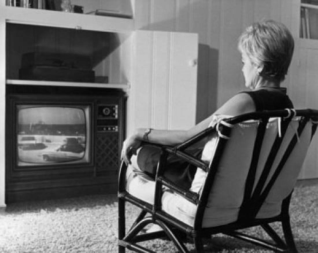 Rear view of a mature woman watching television Canvas Art - (18 x 24)