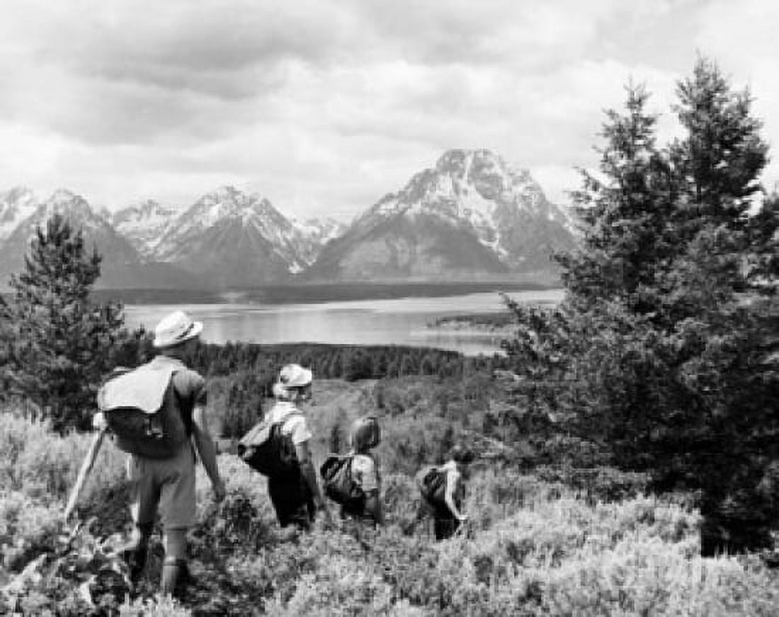 Rear view of a mid adult couple hiking with their children in a forest Grand Teton National Park Wyoming USA Canvas Art - (18 x 24)