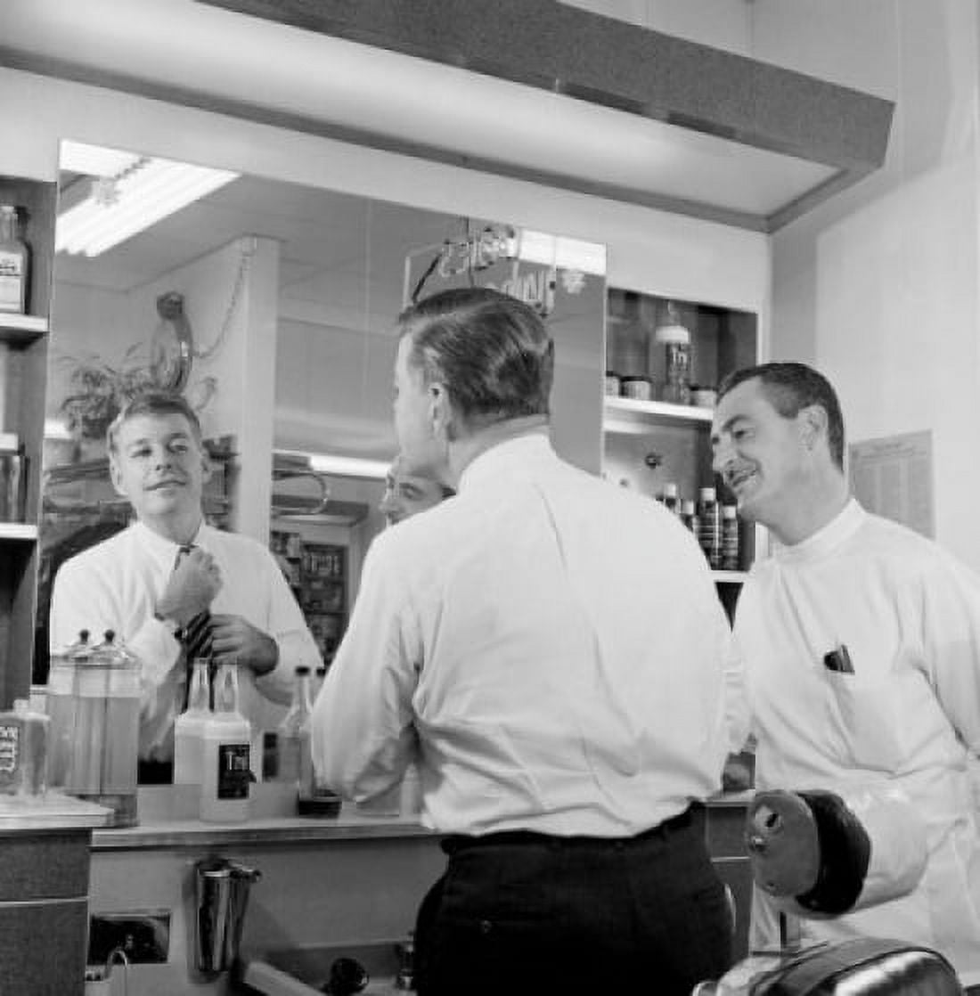 Rear view of a mid adult man looking in a mirror adjusting his tie Canvas Art - (18 x 24)
