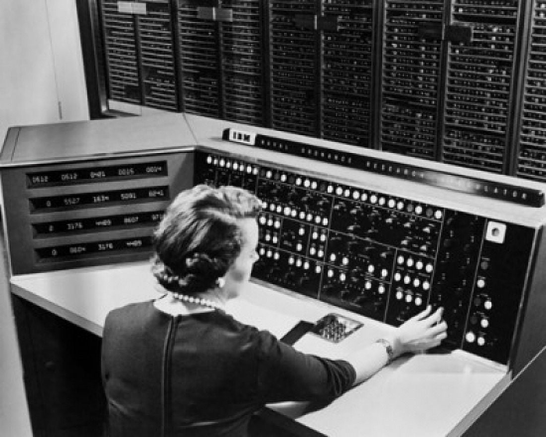 Rear view of a mid adult woman operating NORC Control Console Canvas Art - (24 x 36)