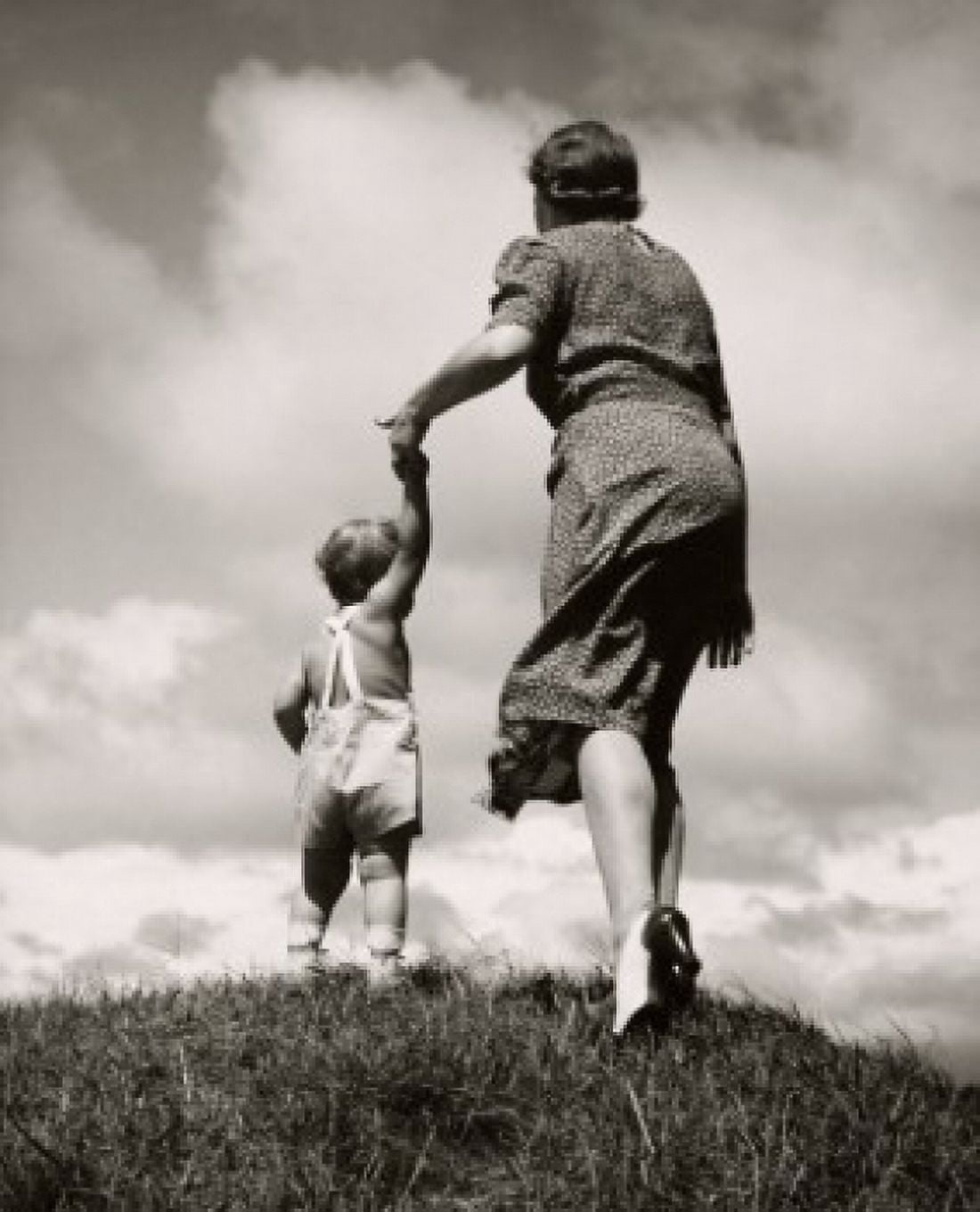 Rear view of a mother holding her sons hand Canvas Art - (18 x 24)