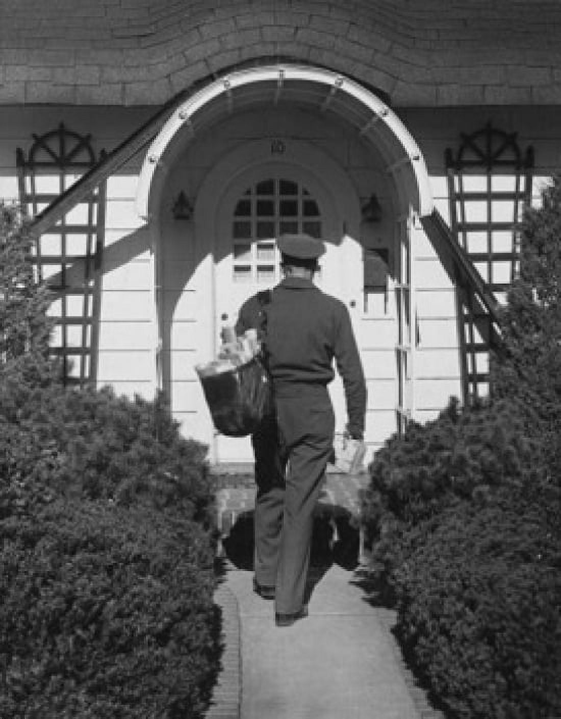 Rear view of a postman delivering mail Canvas Art - (18 x 24)