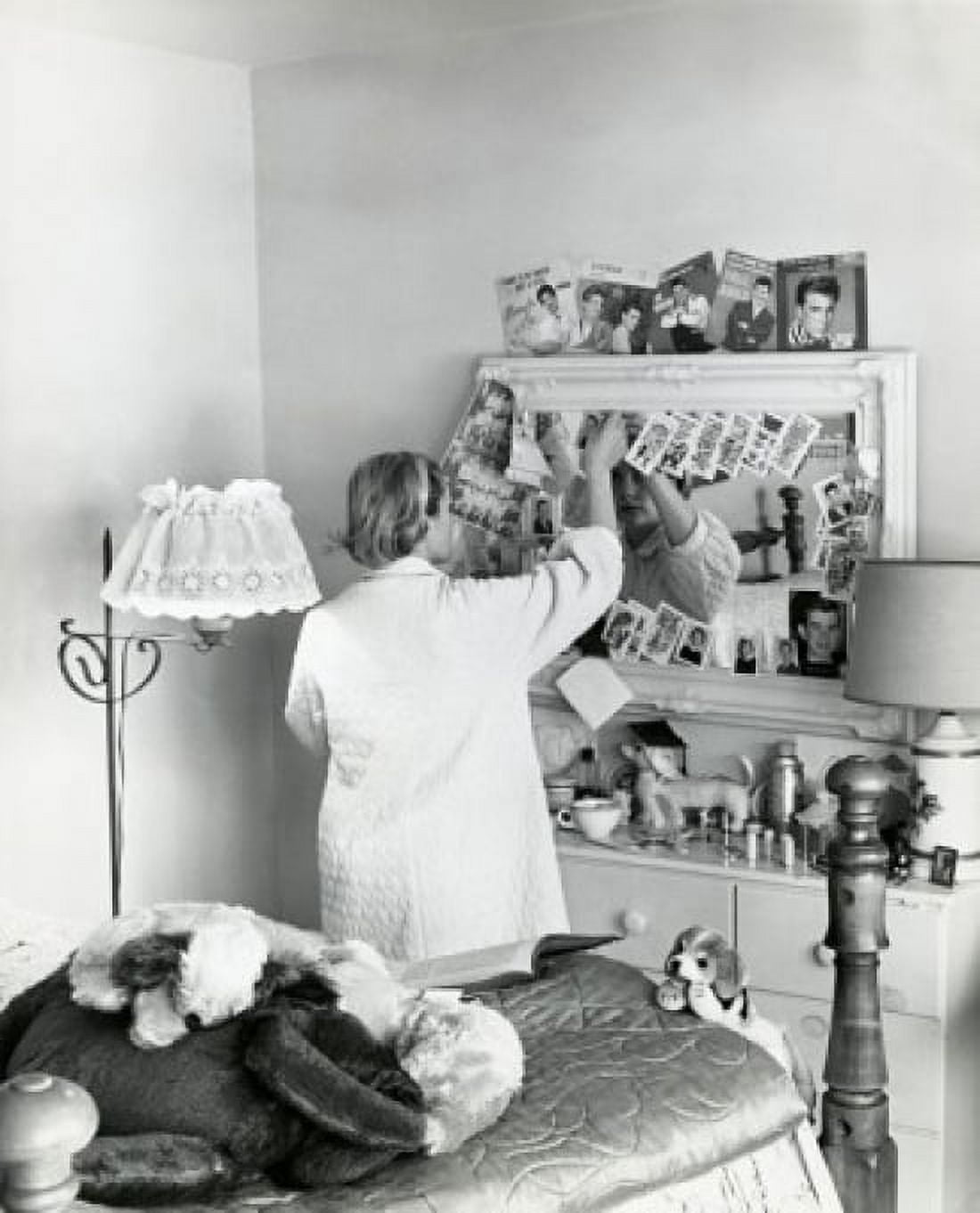 Rear view of a teenage girl standing in front of a mirror in a bedroom 1961 Canvas Art - (18 x 24)