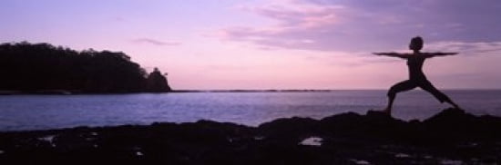 Rear view of a woman exercising on the coast La Punta Papagayo Peninsula Costa Rica Canvas Art - Panoramic Images (36 x 12)
